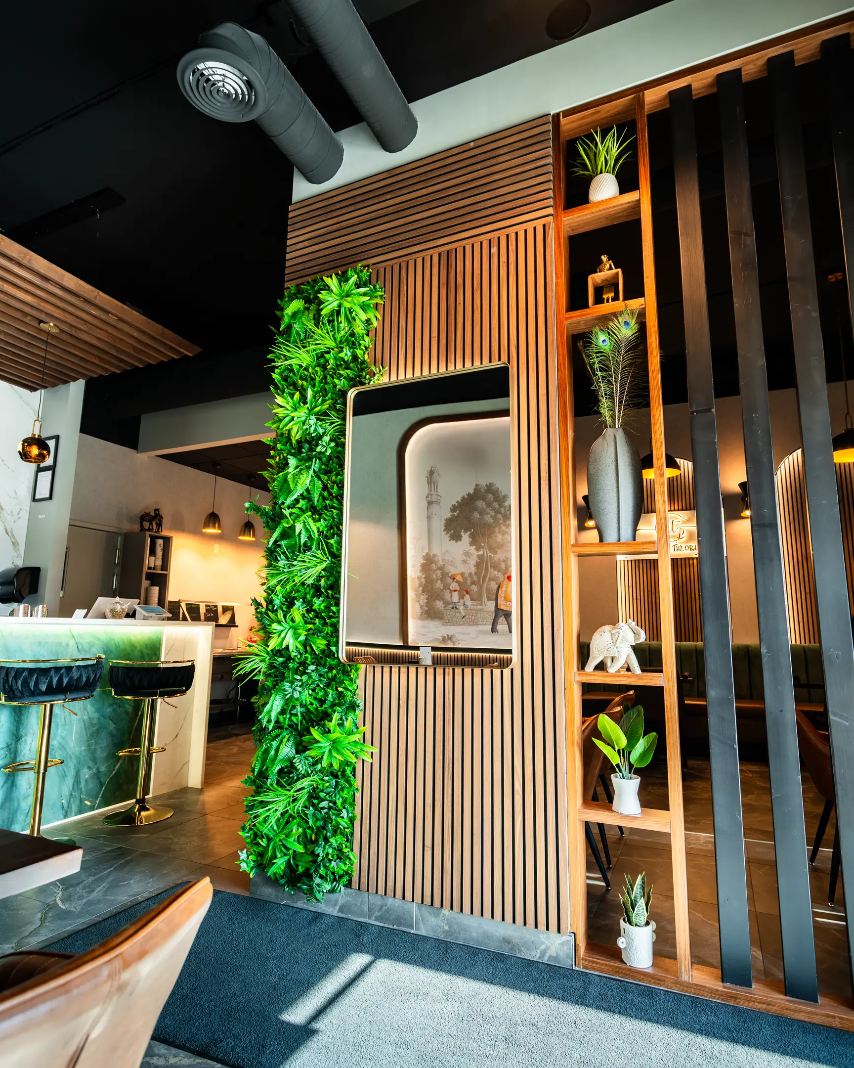 Bar counter and decorated entrance at Masala Theory Indian Bistro & Bar Calgary SE