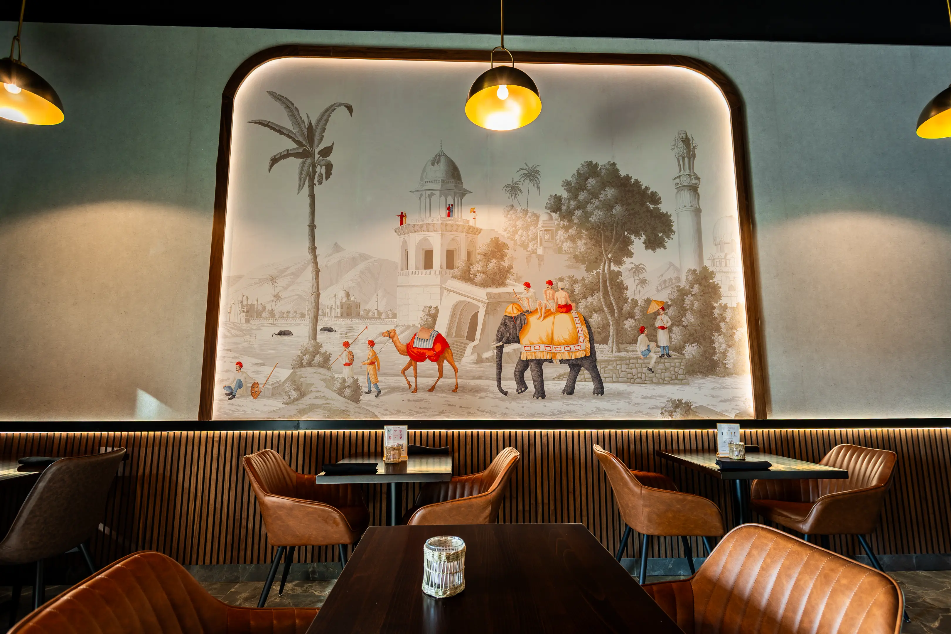 Hand-painted Indian mural above the booth seating at Masala Theory Calgary SE