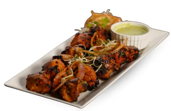 Tandoori Chicken Tikka with onions and mint chutney straight from the clay oven